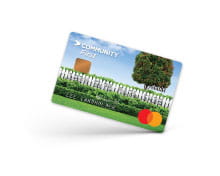 credit card with white picket fence and a tree with a nice lawn
